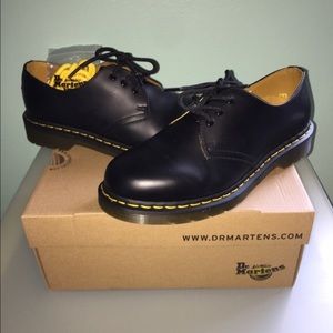 New Dr. Marten 8 eyelet leather shoes.